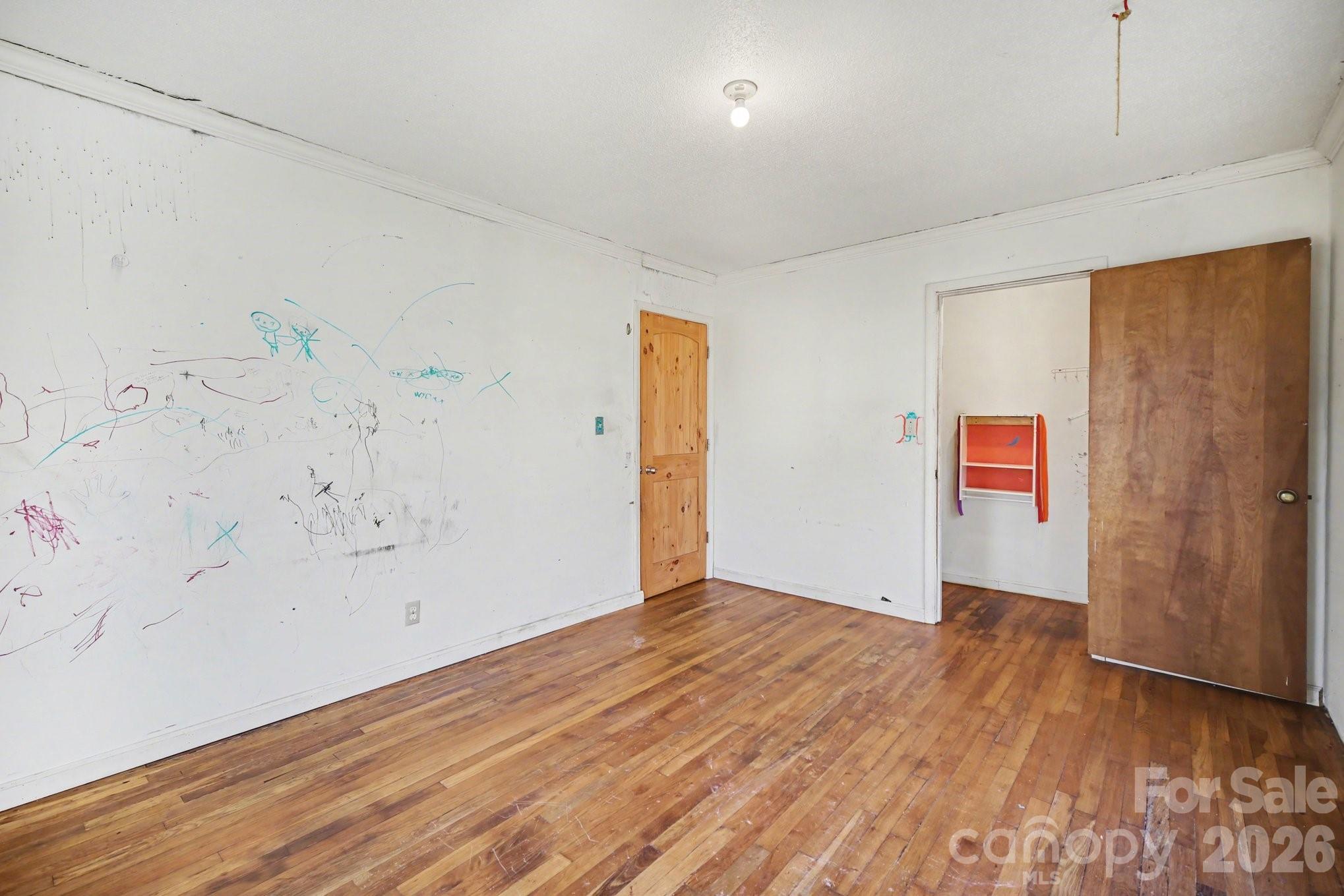 453 Robert Road Cherryville, NC 28021 - Photo 24 of 36 an empty room with wooden floor and window