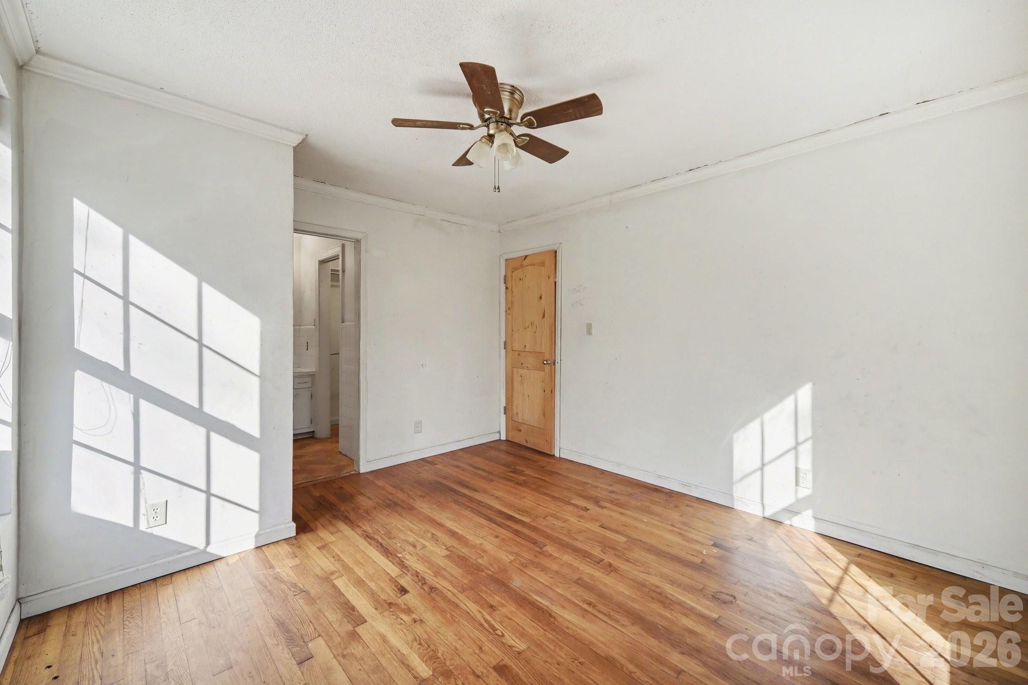 453 Robert Road Cherryville, NC 28021 - Photo 28 of 36 wooden floor in an empty room with a window
