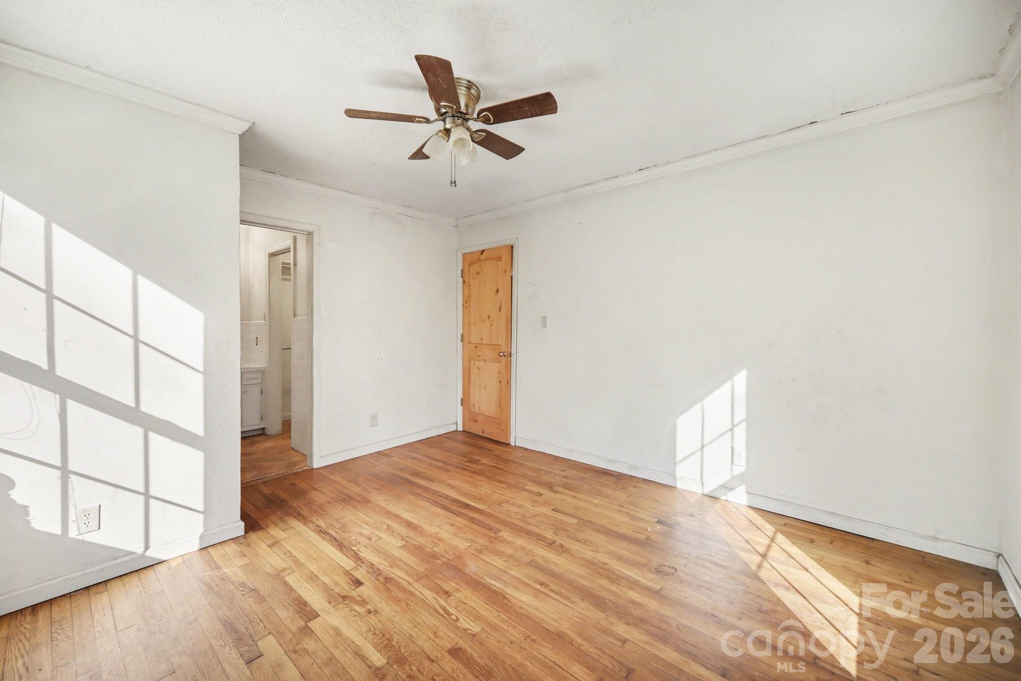 453 Robert Road Cherryville, NC 28021 - Photo 30 of 36 a view of empty room with wooden floor and fan