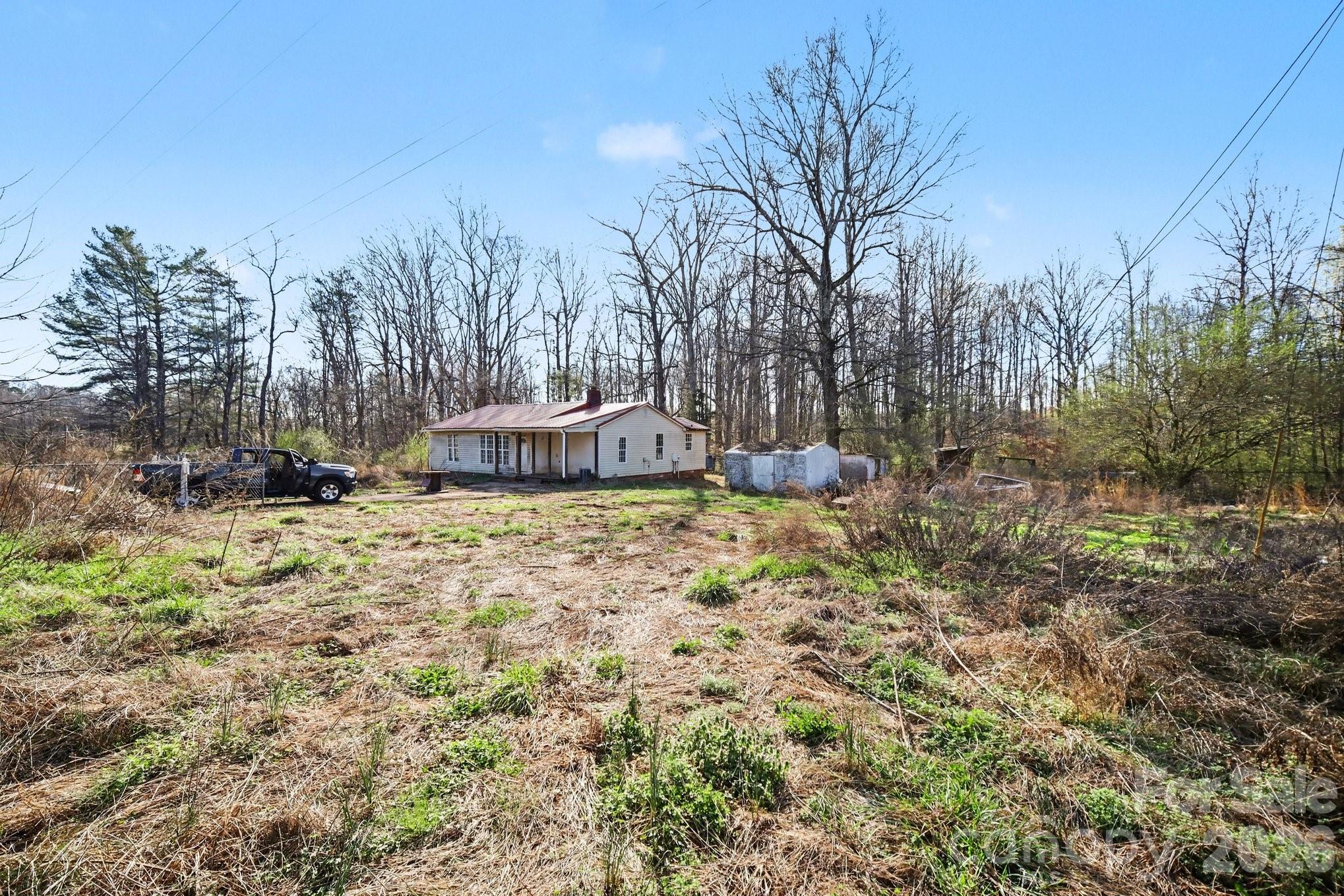 453 Robert Road Cherryville, NC 28021 - Photo 3 of 36 a backyard of a house with lots of green space