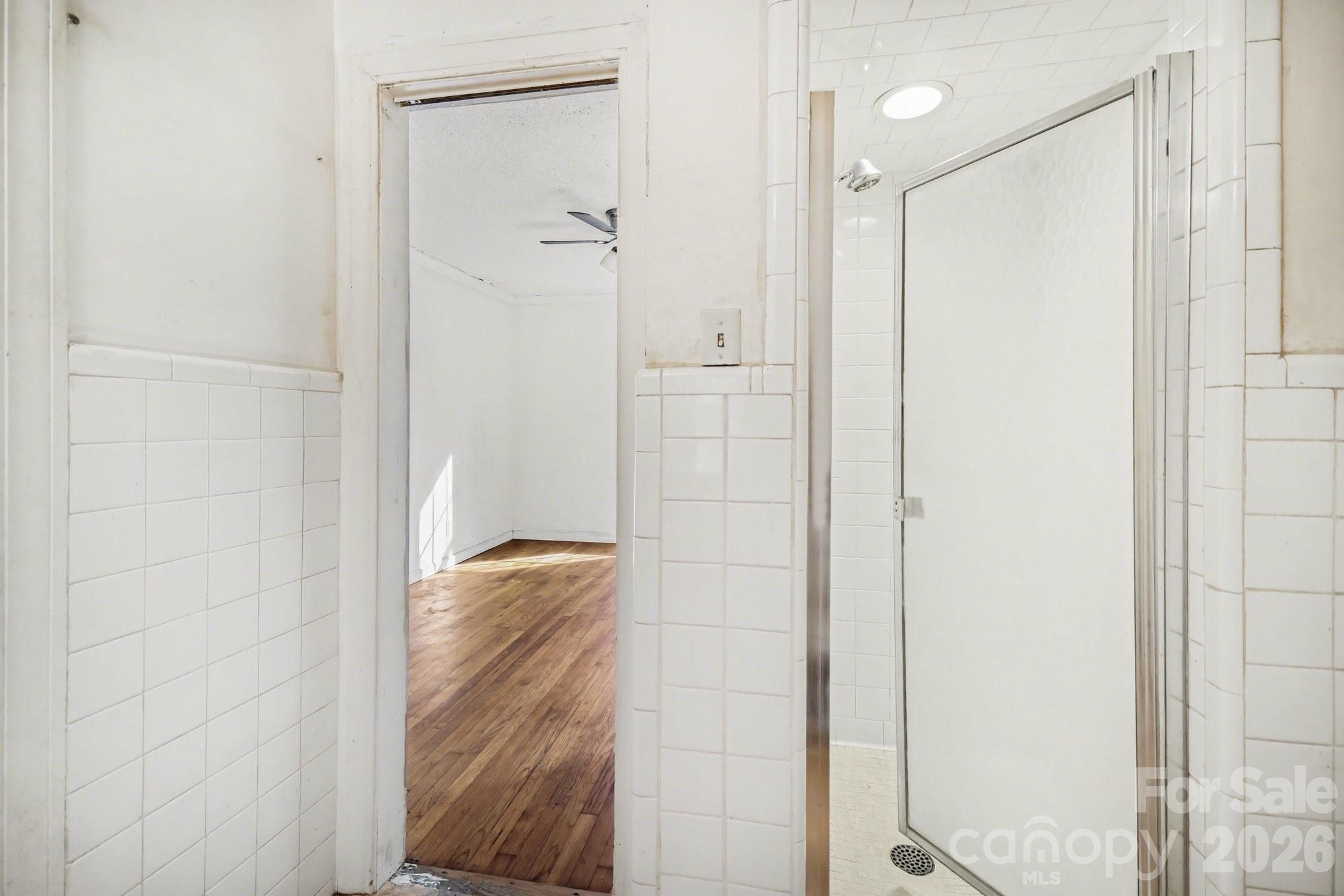 453 Robert Road Cherryville, NC 28021 - Photo 32 of 36 a bathroom with a shower and a glass door