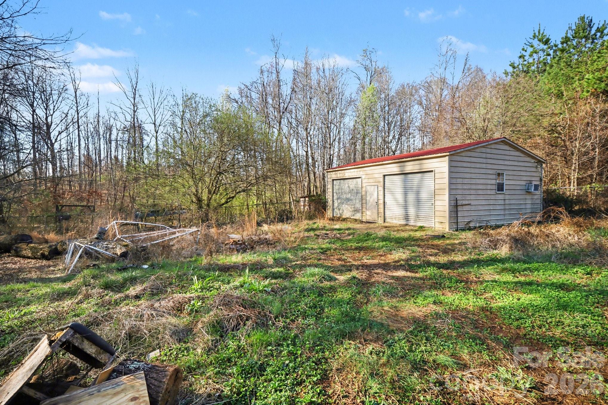 453 Robert Road Cherryville, NC 28021 - Photo 36 of 36 a backyard of a house with lots of green space