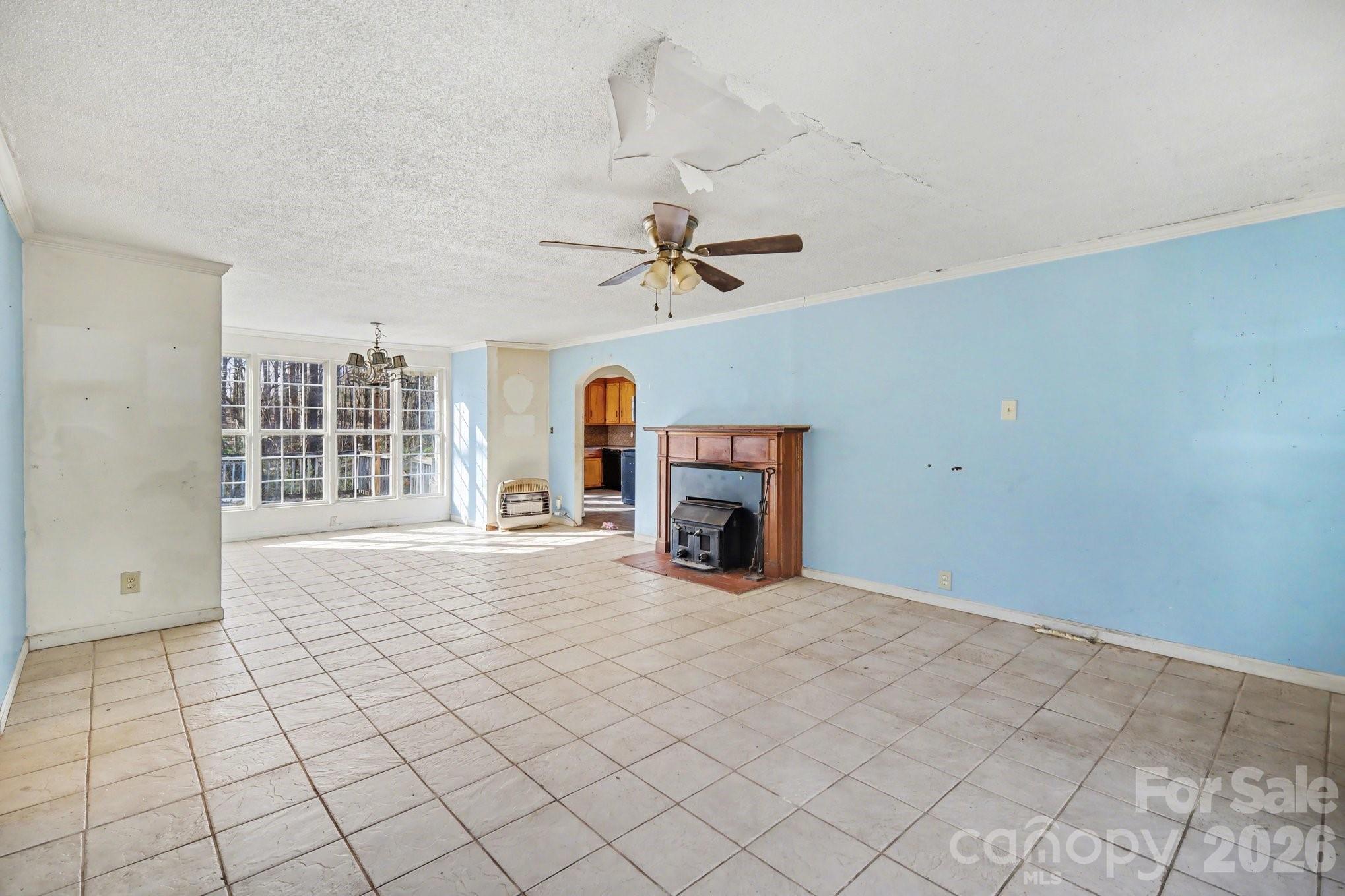 453 Robert Road Cherryville, NC 28021 - Photo 5 of 36 a view of an empty room with a fireplace