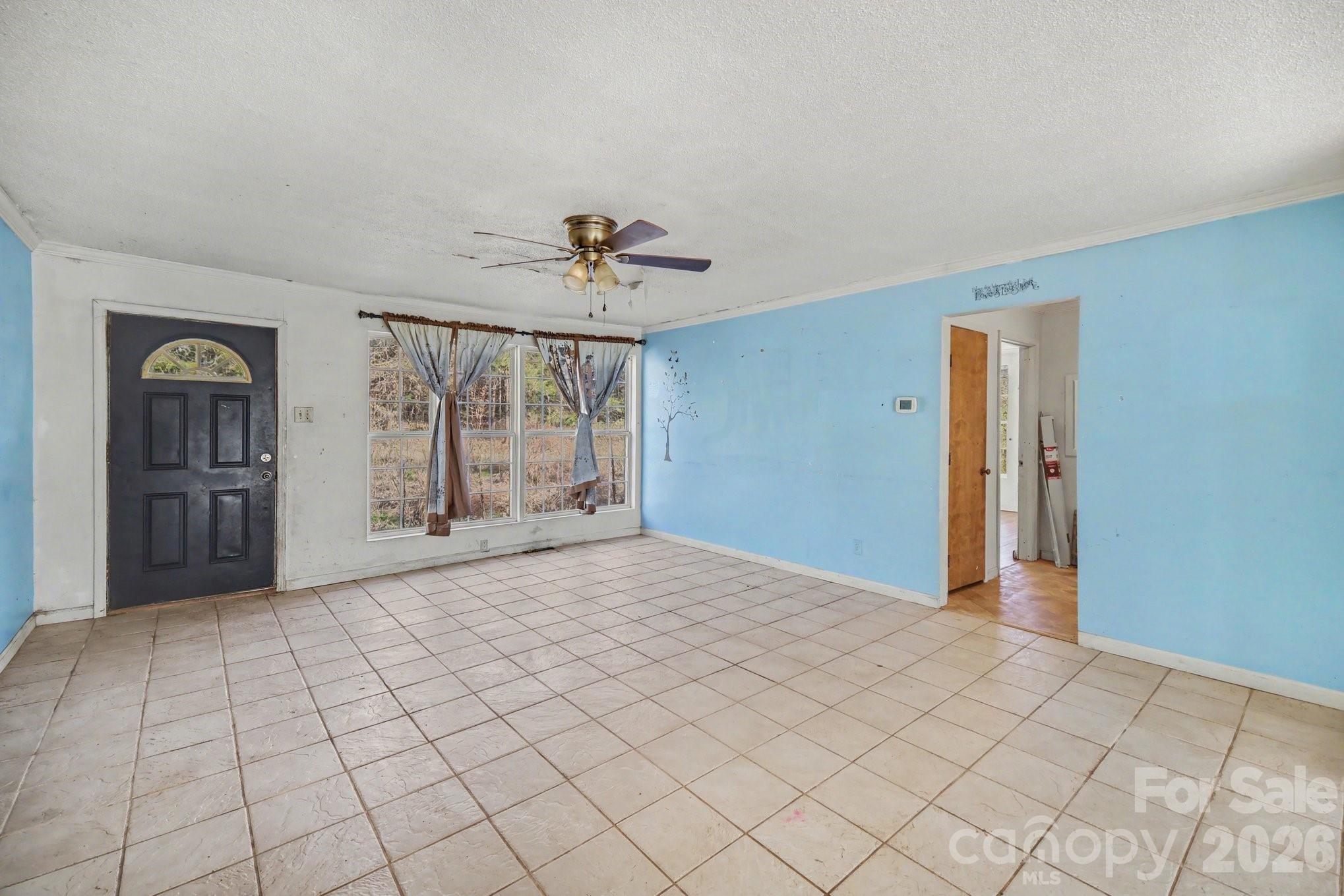 453 Robert Road Cherryville, NC 28021 - Photo 8 of 36 a view of an empty room with window and cabinet