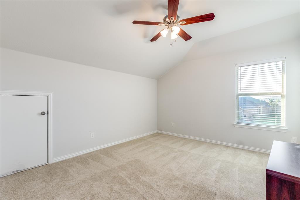 4542 Kipling Avenue Aubrey, TX 76227 - Photo 26 of 36 Additional living space featuring vaulted ceiling, light colored carpet, and ceiling fan