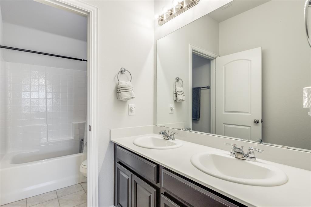 4542 Kipling Avenue Aubrey, TX 76227 - Photo 29 of 36 Full bathroom with light tile patterned floors, double vanity, and shower / bath combination