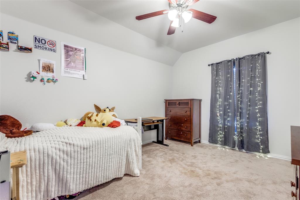 4542 Kipling Avenue Aubrey, TX 76227 - Photo 30 of 36 Carpeted bedroom featuring vaulted ceiling and ceiling fan