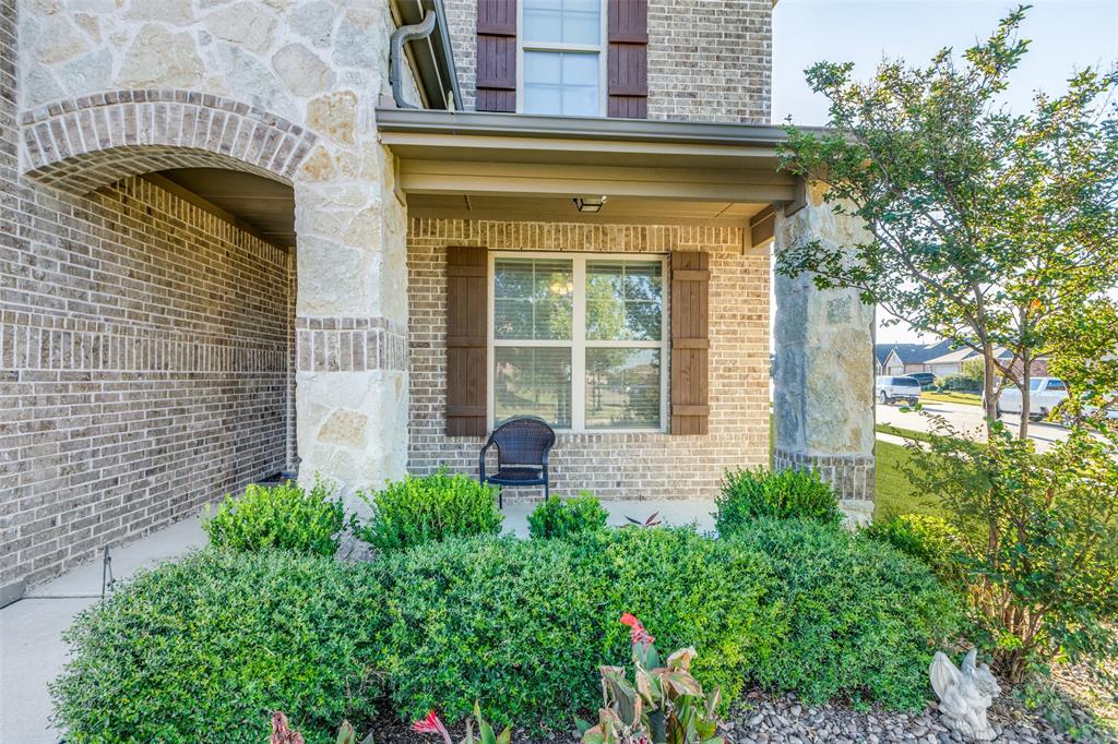 4542 Kipling Avenue Aubrey, TX 76227 - Photo 4 of 36 Property entrance featuring brick siding, a porch, and stone siding