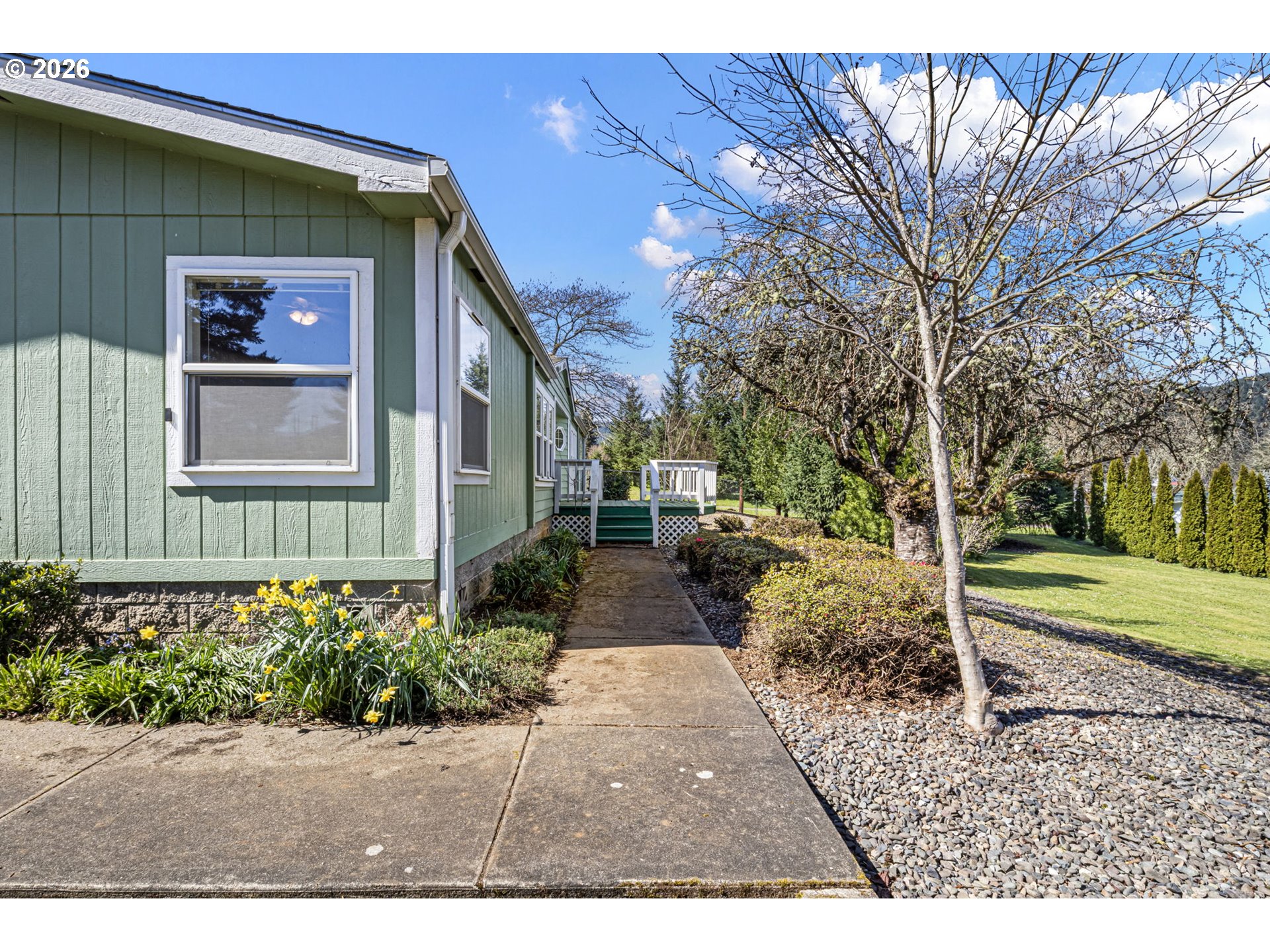 500 Elm Street Yoncalla, OR 97499 - Photo 12 of 48 a front view of a house with garden