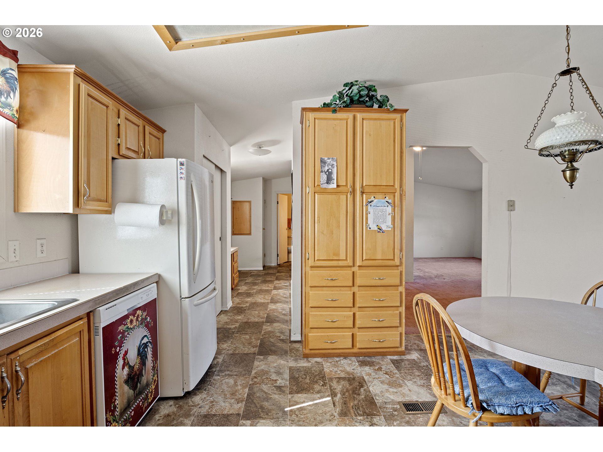 500 Elm Street Yoncalla, OR 97499 - Photo 18 of 48 a kitchen with refrigerator cabinets and wooden floor