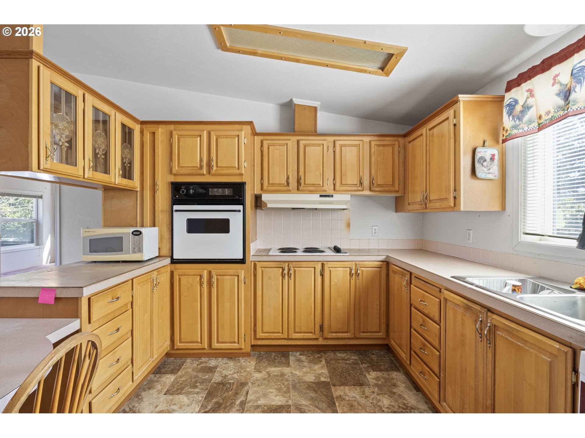 500 Elm Street Yoncalla, OR 97499 - Photo 19 of 48 a kitchen with stainless steel appliances granite countertop a stove a sink and a microwave