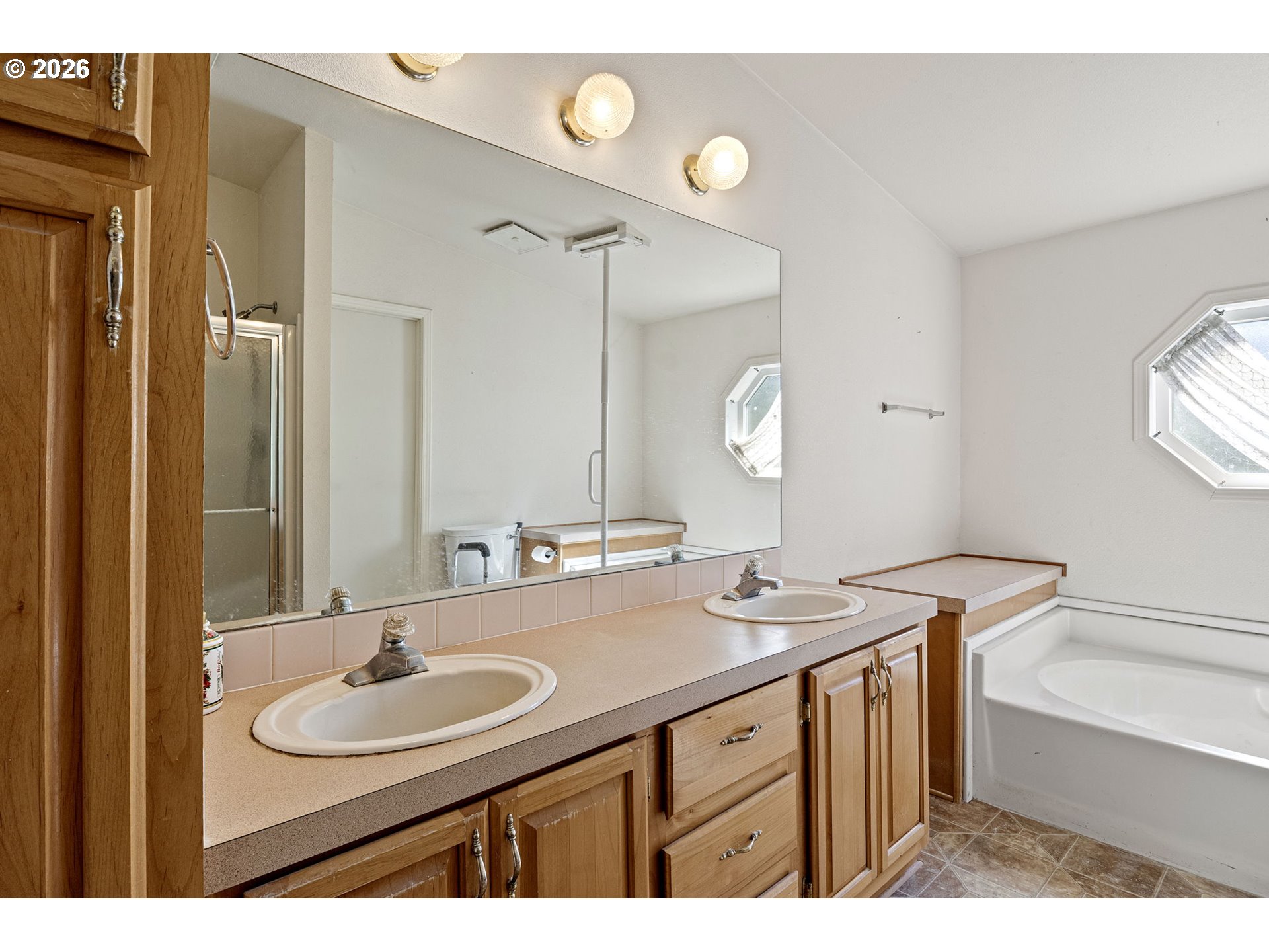 500 Elm Street Yoncalla, OR 97499 - Photo 30 of 48 a bathroom with a sink double vanity granite tub and a mirror
