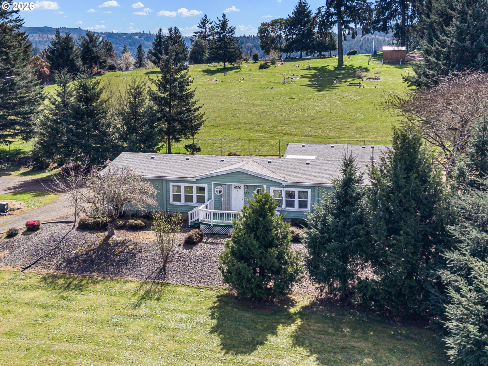 500 Elm Street Yoncalla, OR 97499 - Photo 5 of 48 a aerial view of a house with a garden and lake view
