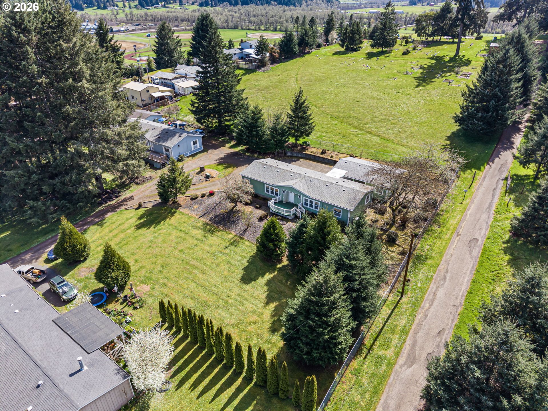 500 Elm Street Yoncalla, OR 97499 - Photo 8 of 48 a view of a lake with a building in the background