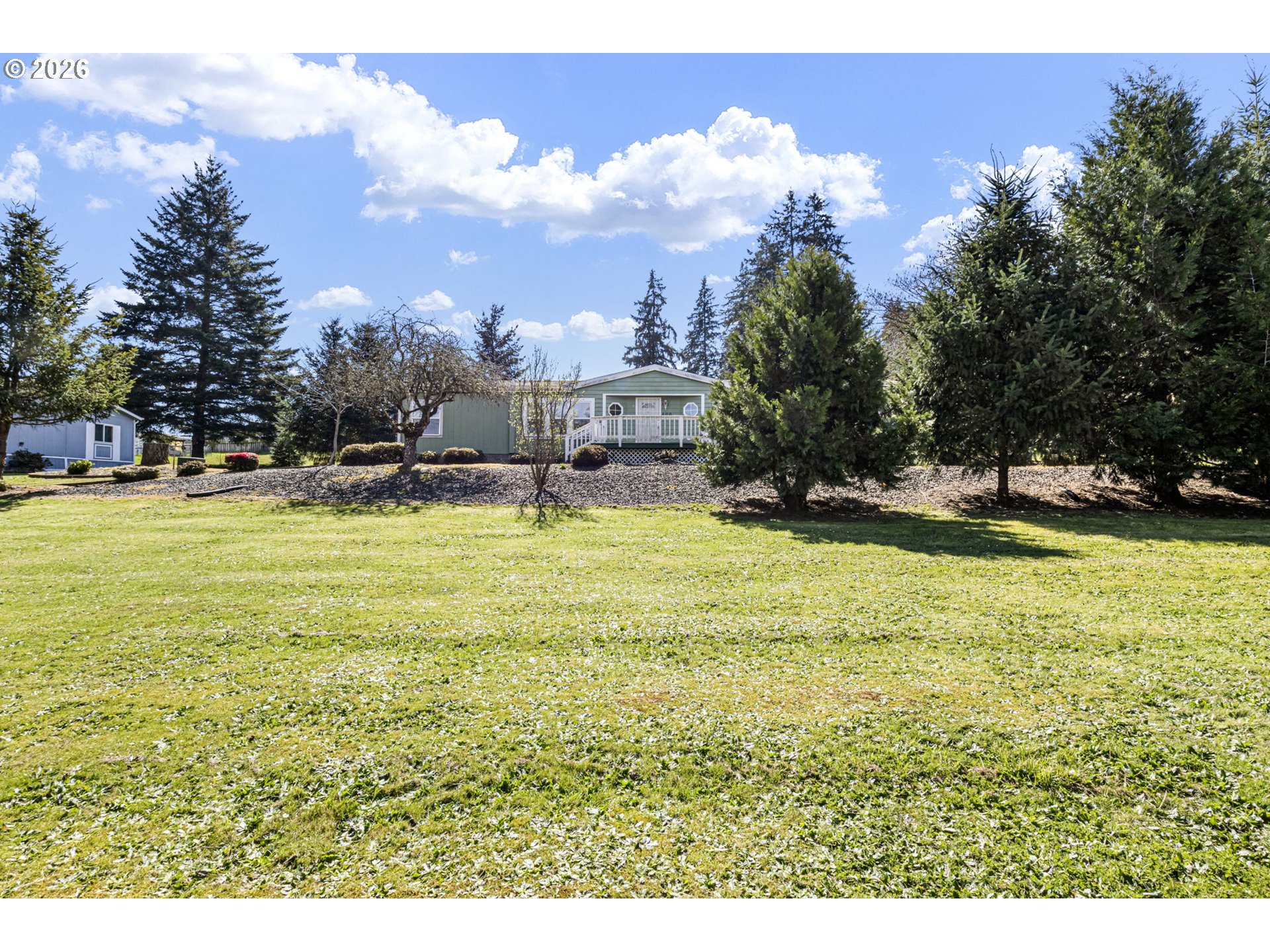 500 Elm Street Yoncalla, OR 97499 - Photo 9 of 48 a view of a swimming pool with an outdoor space and seating area