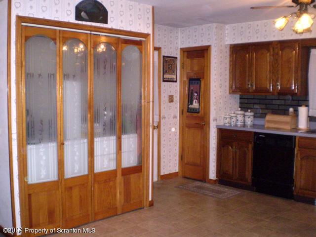 3772 Quarry Road Nicholson, PA 18446 - Photo 3 of 16 a view of a door and kitchen with furniture