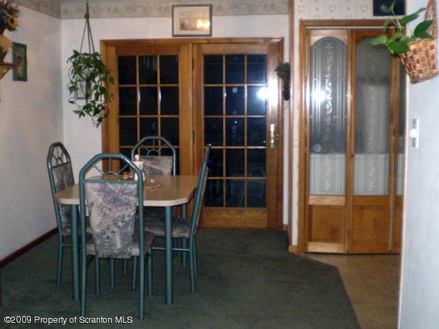 3772 Quarry Road Nicholson, PA 18446 - Photo 6 of 16 a view of a dining room with furniture and chandelier