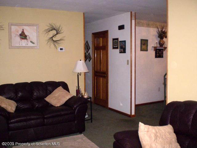 3772 Quarry Road Nicholson, PA 18446 - Photo 8 of 16 a living room with furniture and a refrigerator