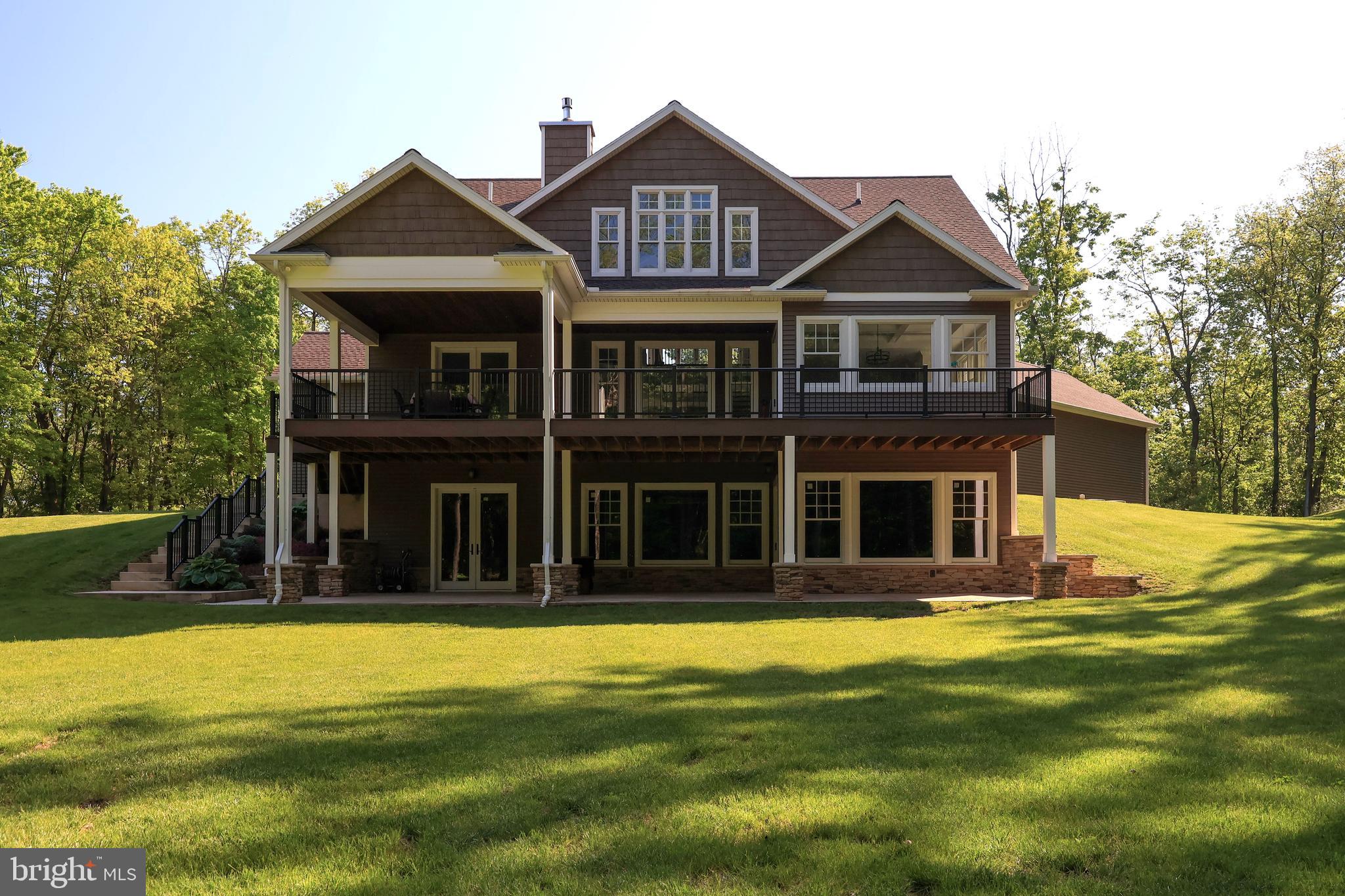 518 Two Mile Road Howard, PA 16841 - Photo 58 of 84 a front view of a house with garden