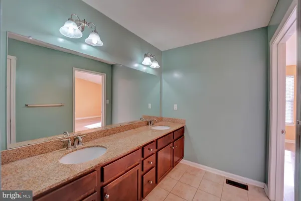 a bathroom with a shower and a sink