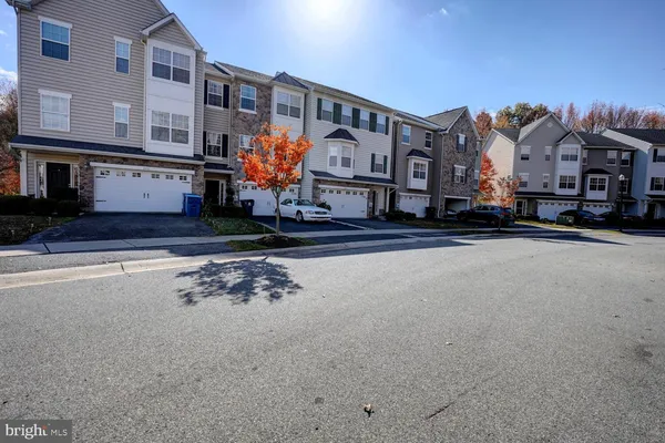 a front view of a building with many windows