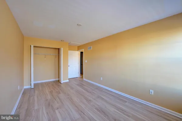 a bathroom with a sink mirror vanity and toilet