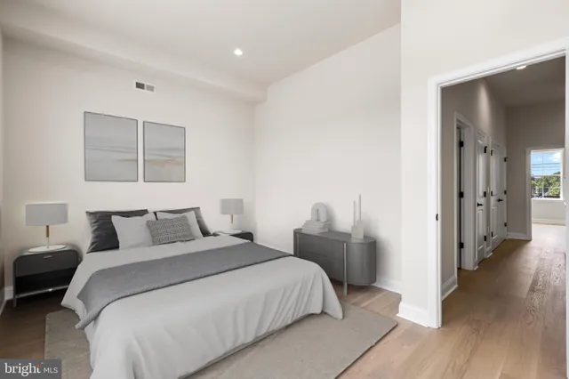 a bedroom with a bed and a walk in closet