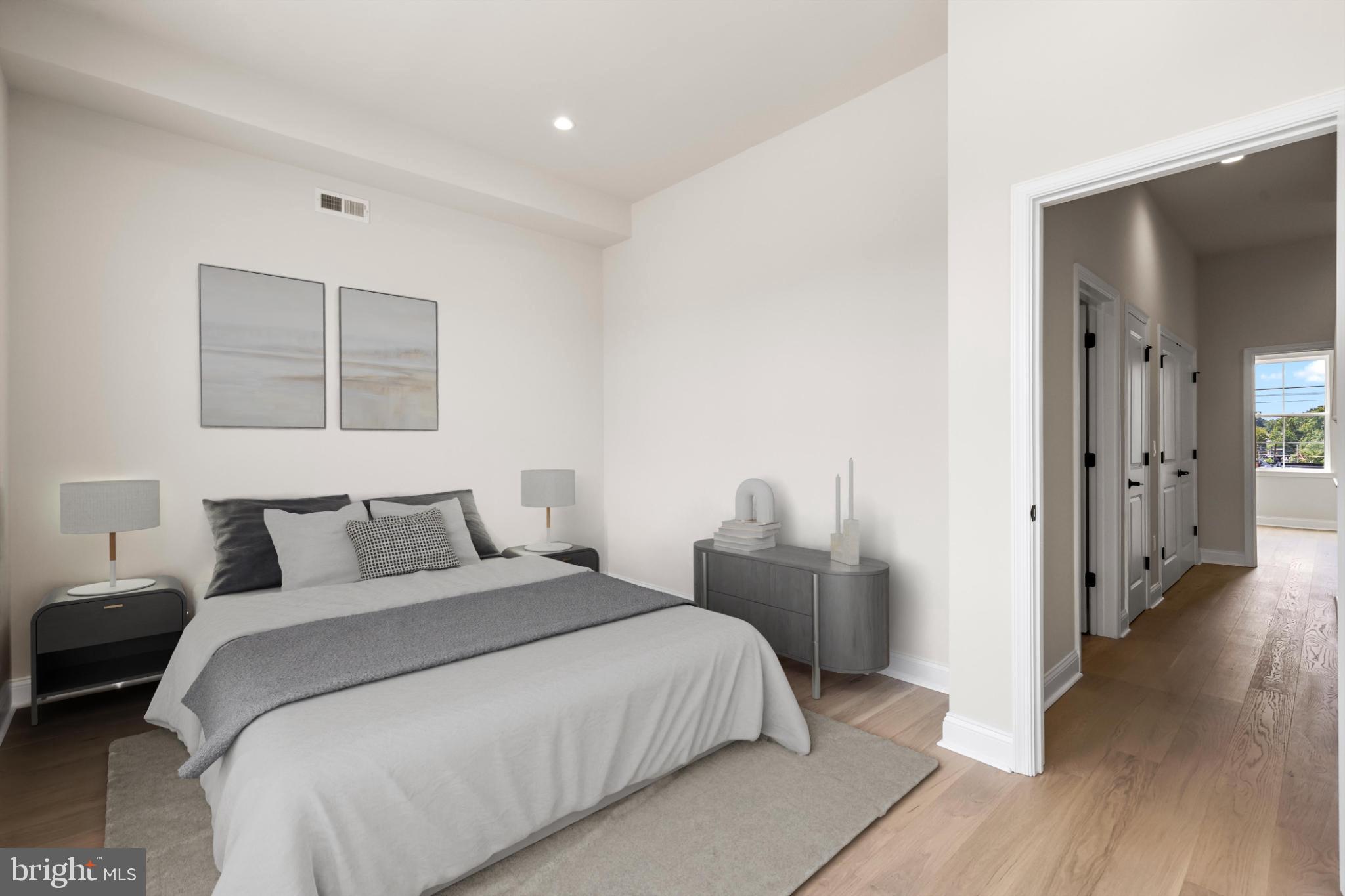 4032 (4050) Marilyn (conshohocken Ave) Drive Philadelphia, PA 19131 - Photo 11 of 42 Serene bedroom with modern elegance.