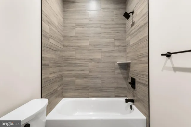 a bathroom with a white bathtub