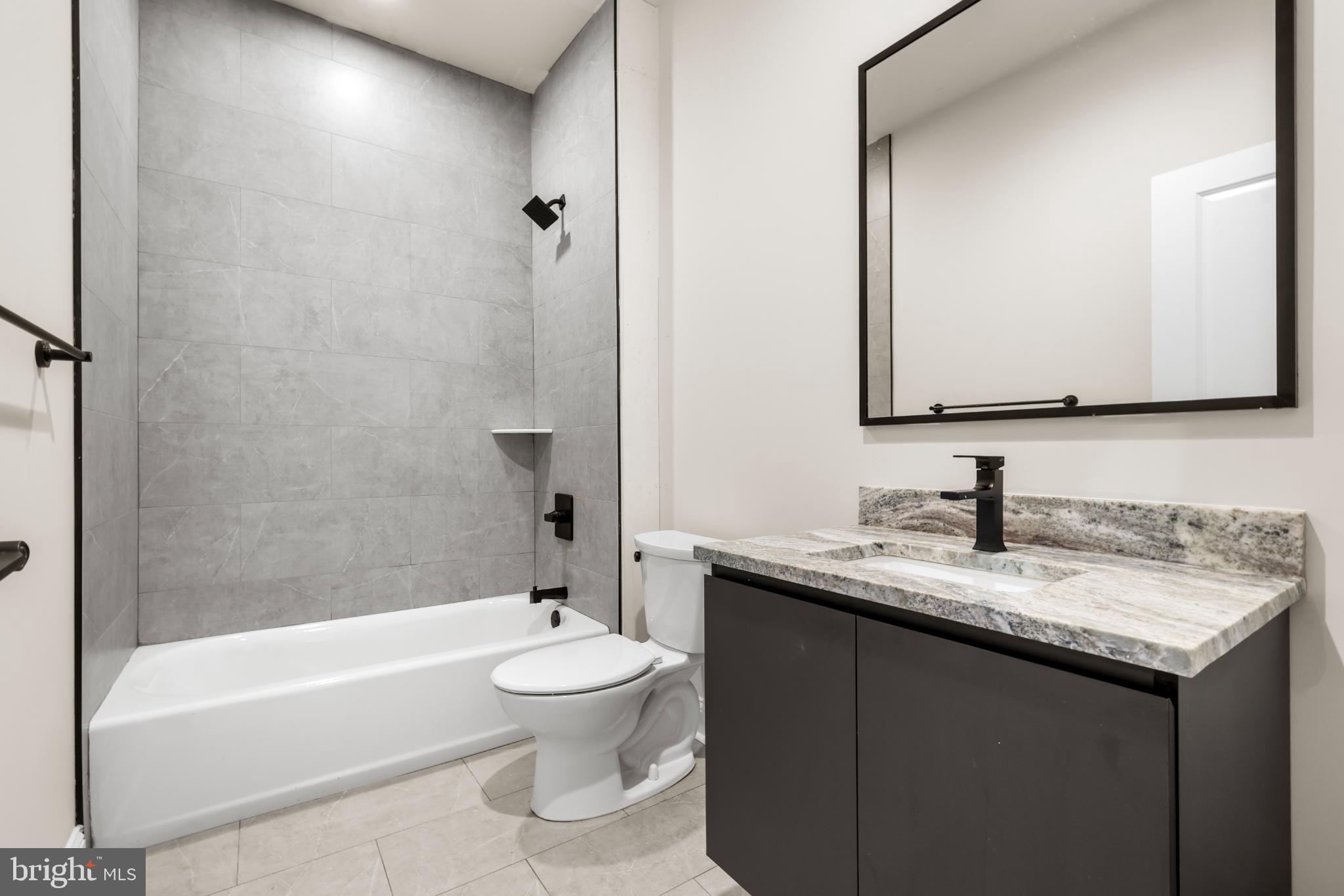 4032 (4050) Marilyn (conshohocken Ave) Drive Philadelphia, PA 19131 - Photo 18 of 42 Sleek modern bathroom with elegant finishes.