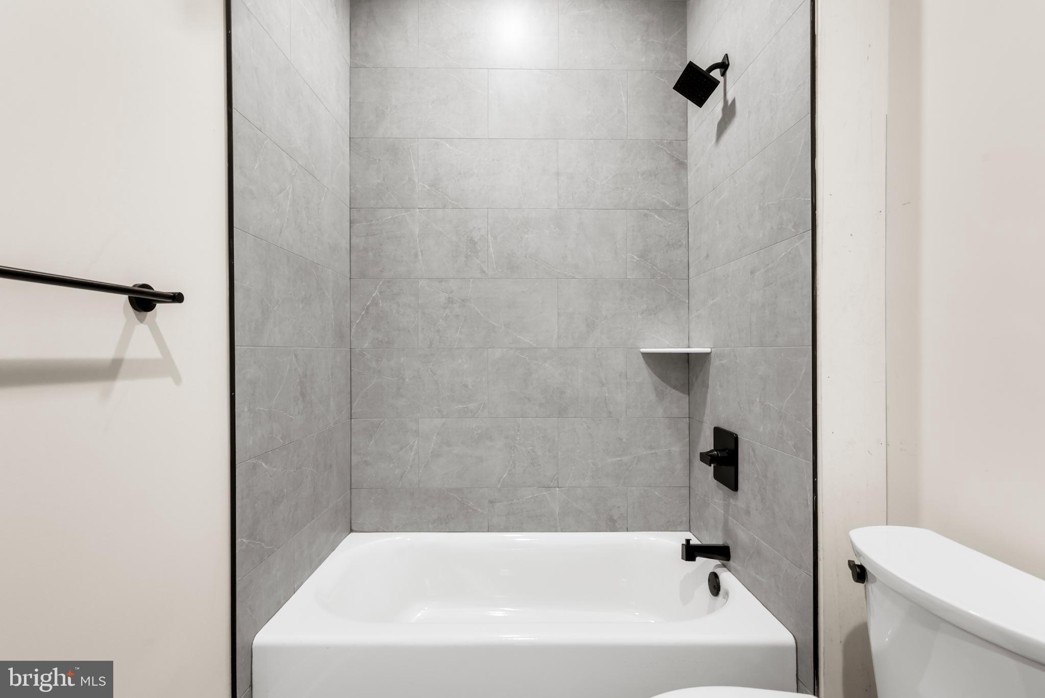 4032 (4050) Marilyn (conshohocken Ave) Drive Philadelphia, PA 19131 - Photo 19 of 42 Sleek modern bathroom with elegant finishes.