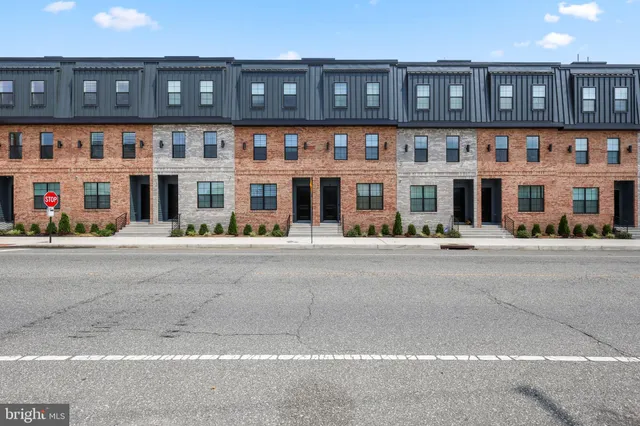 a front view of building with street