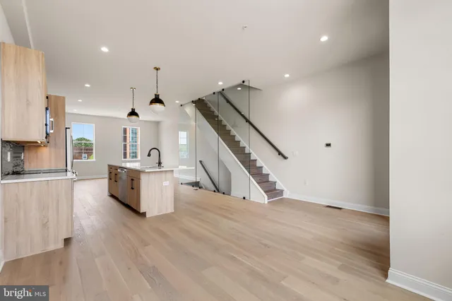 a view of kitchen with furniture and wooden floor