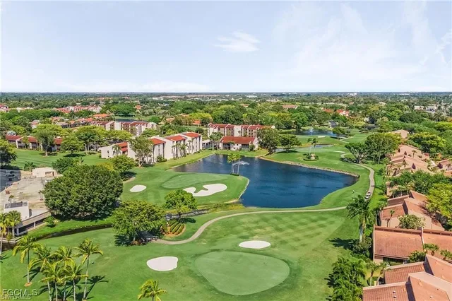 an aerial view of a golf course with chairs