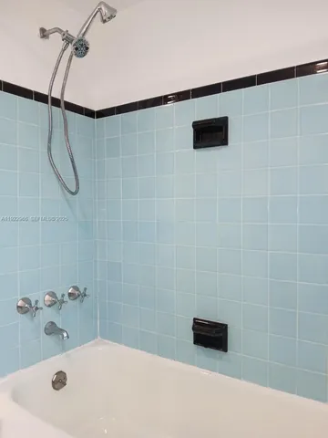 a bathroom with a shower and a bathtub