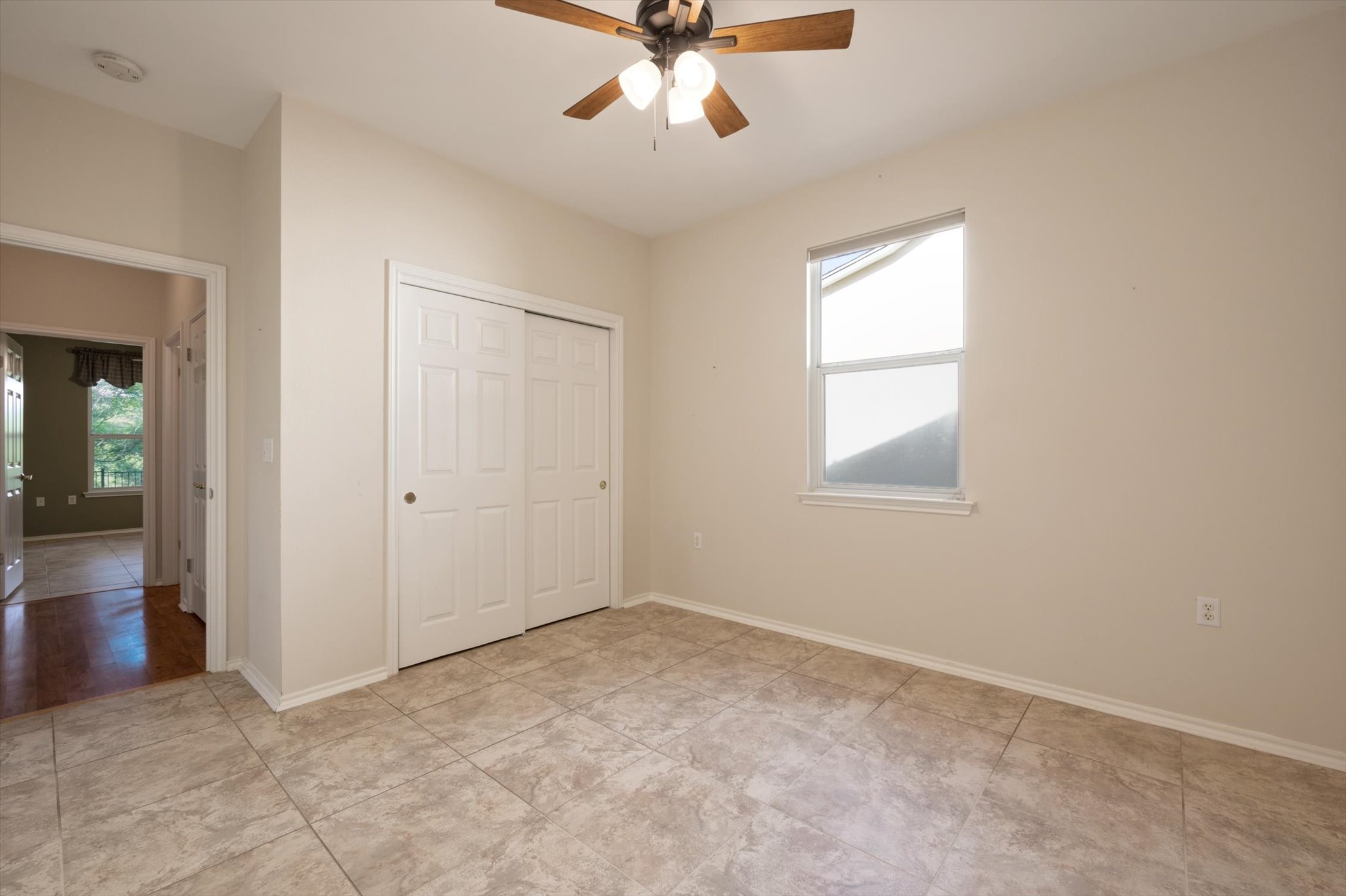 126 Trail Rider Way Georgetown, TX 78633 - Photo 18 of 30 an empty room with fan and windows