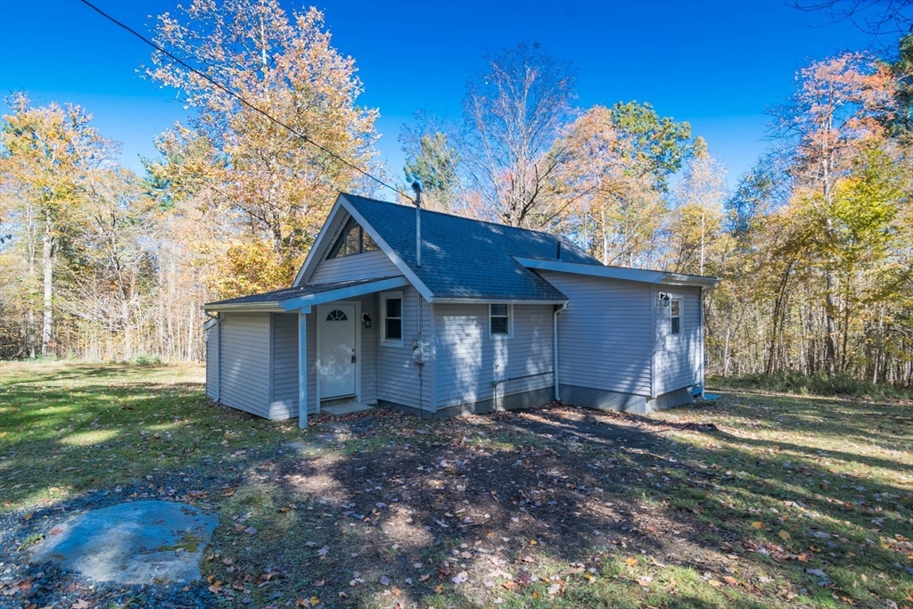 56 Ball Road Goshen, MA 01096 - Photo 1 of 33 a view of a house with a yard