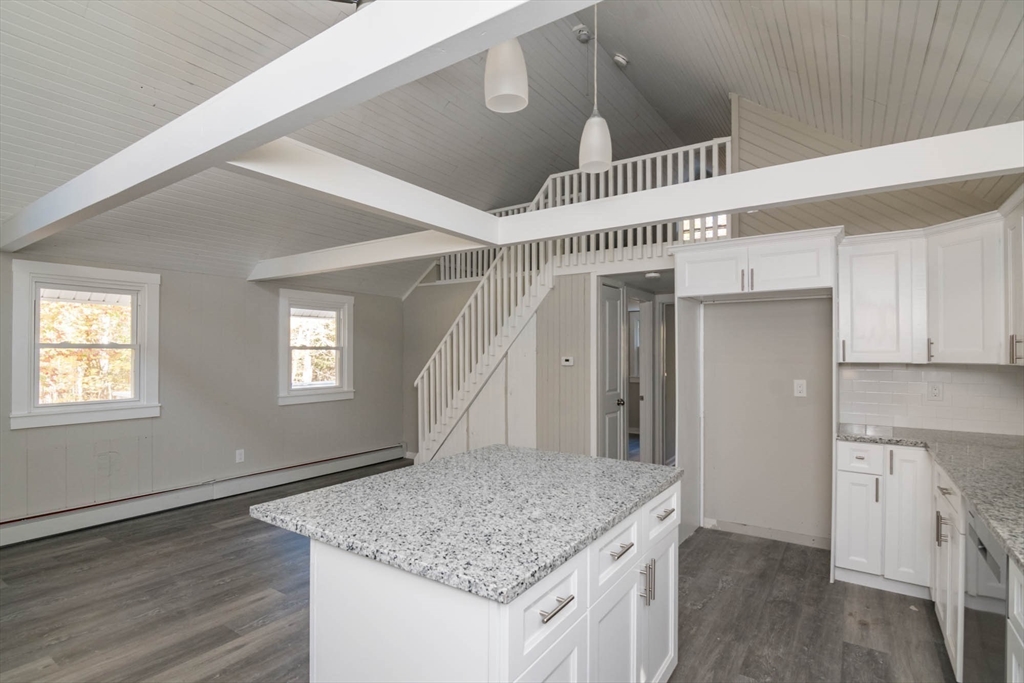56 Ball Road Goshen, MA 01096 - Photo 17 of 33 a kitchen with a sink a refrigerator and window