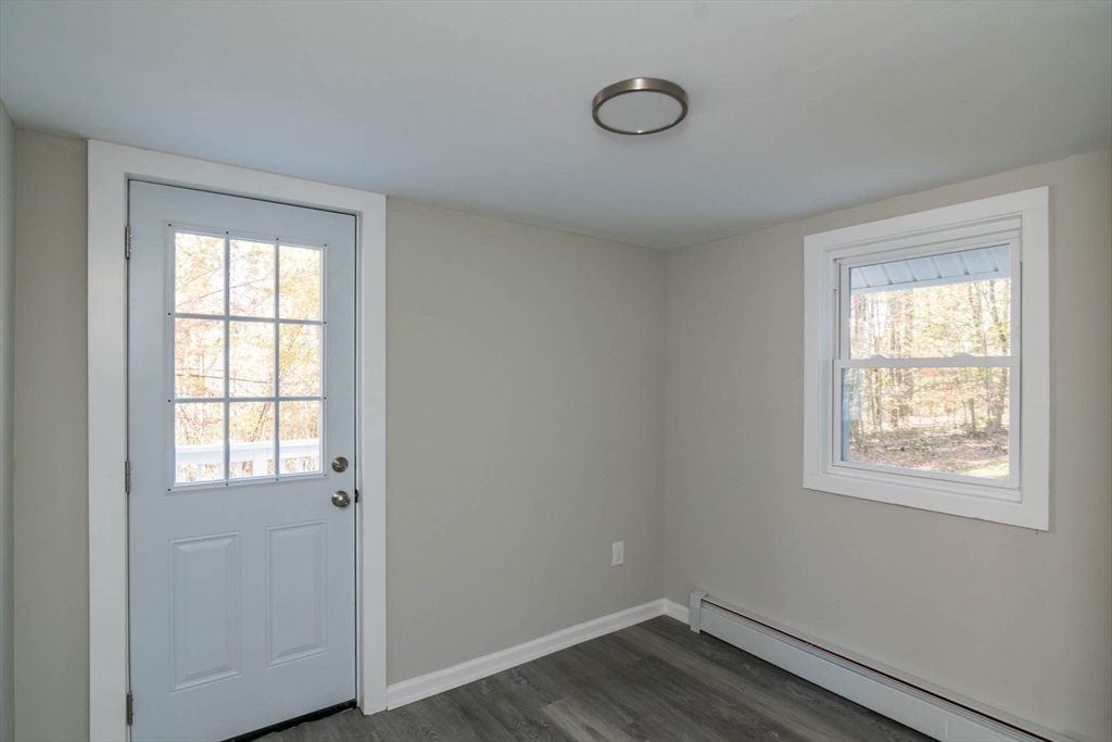 56 Ball Road Goshen, MA 01096 - Photo 24 of 33 a view of an empty room with wooden floor and a window