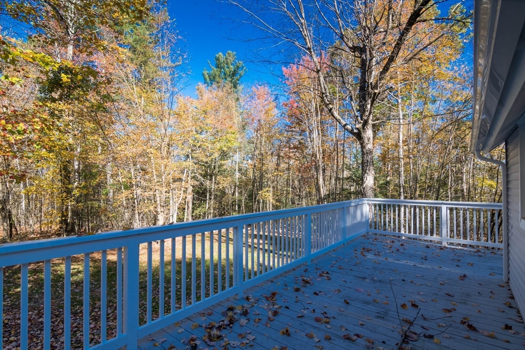 56 Ball Road Goshen, MA 01096 - Photo 8 of 33 a view of a yard with wooden fence and floor