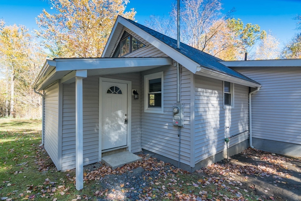56 Ball Road Goshen, MA 01096 - Photo 10 of 33 a view of a small house with a door