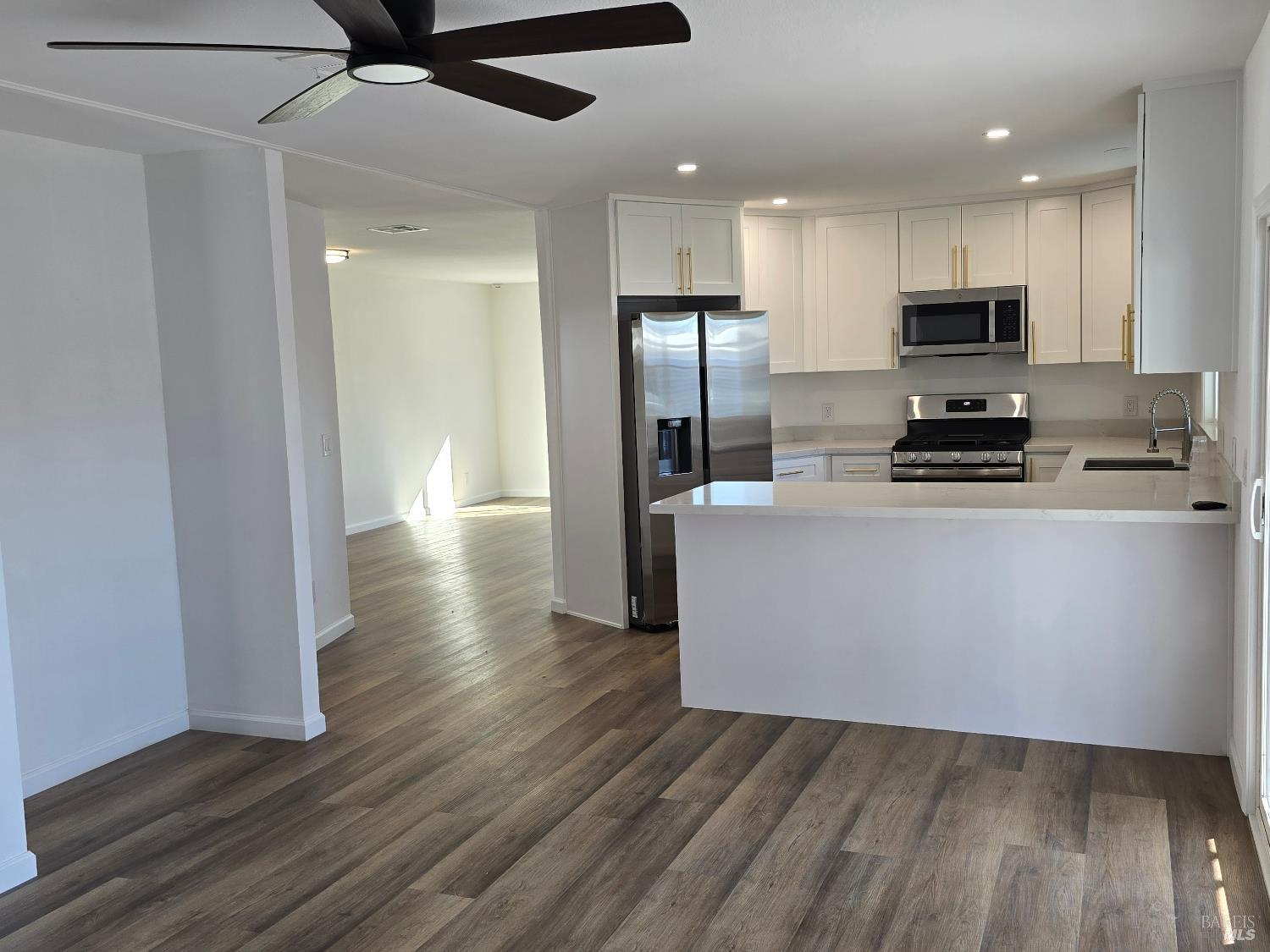 468 Colonial Park Drive Santa Rosa, CA 95403 - Photo 12 of 26 a kitchen with stainless steel appliances a refrigerator and a stove top oven