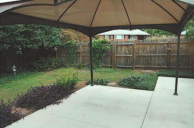 a view of backyard with green space