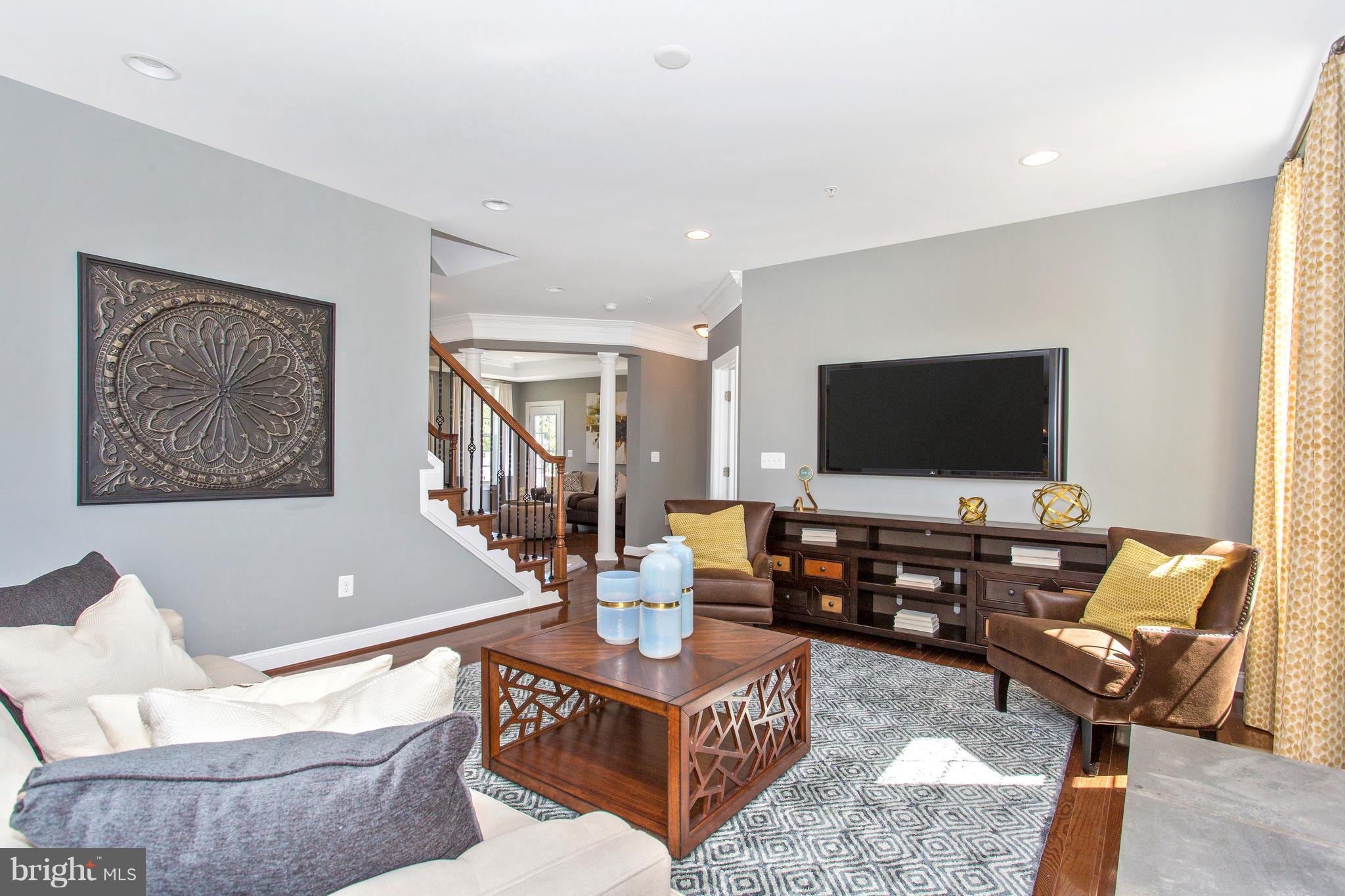 2112 Gable Drive Jessup, MD 20794 - Photo 11 of 27 a living room with furniture and a flat screen tv