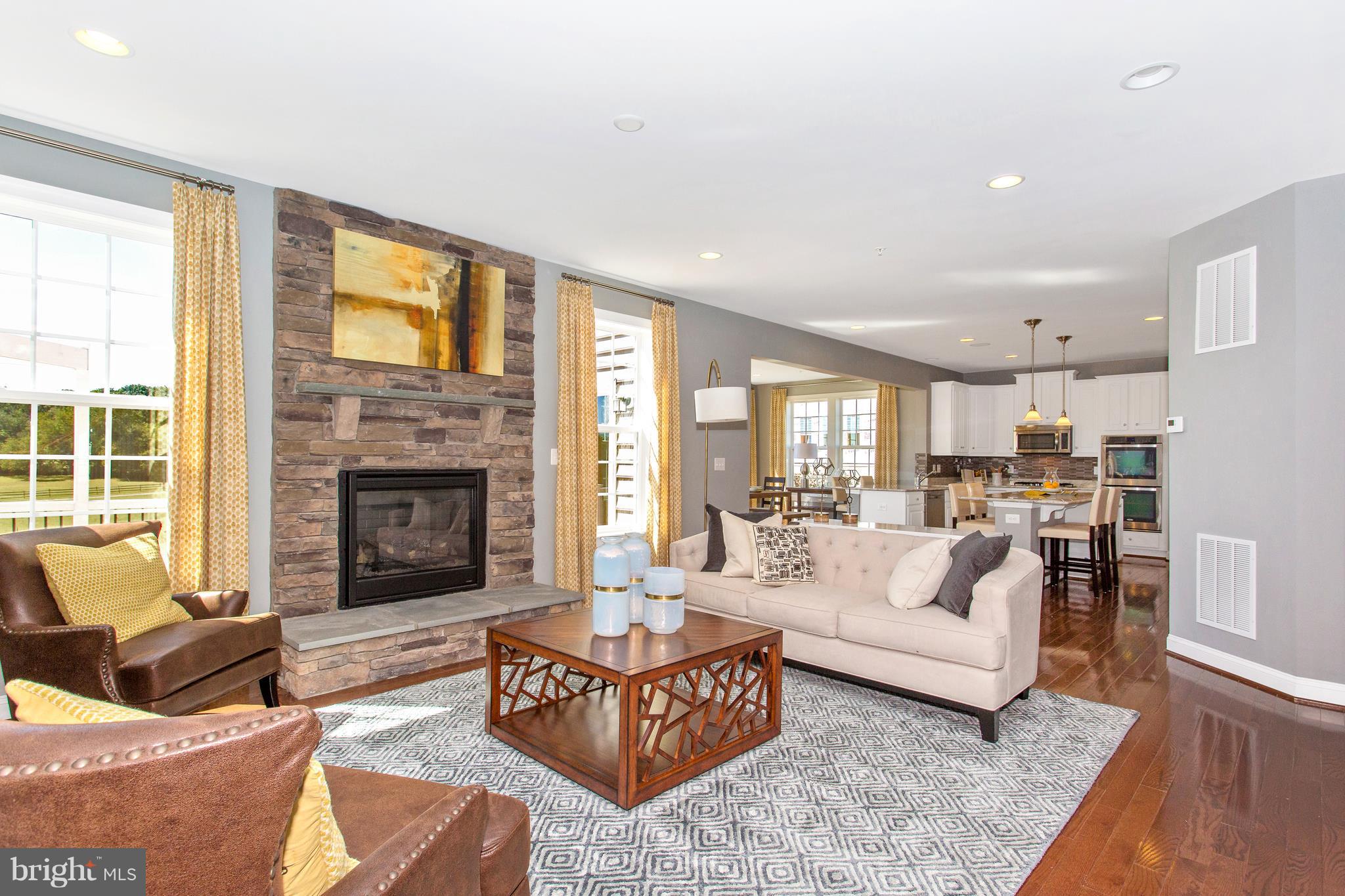 2112 Gable Drive Jessup, MD 20794 - Photo 18 of 27 a living room with furniture and a fireplace