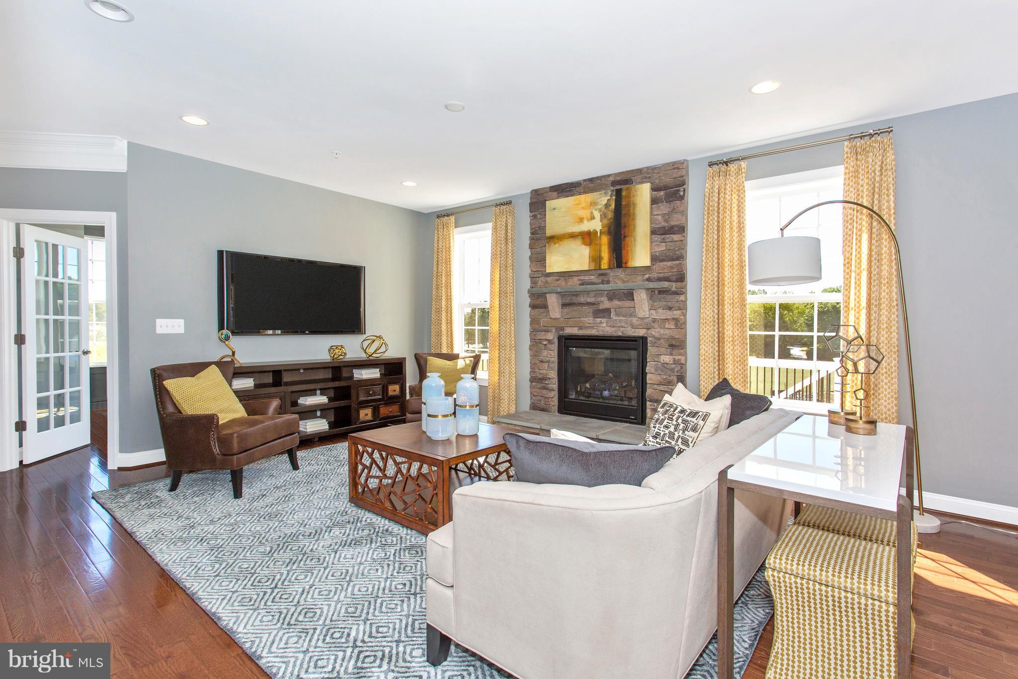 2112 Gable Drive Jessup, MD 20794 - Photo 19 of 27 a living room with furniture and a flat screen tv