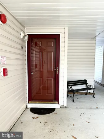 a view of a porch with a table and chair