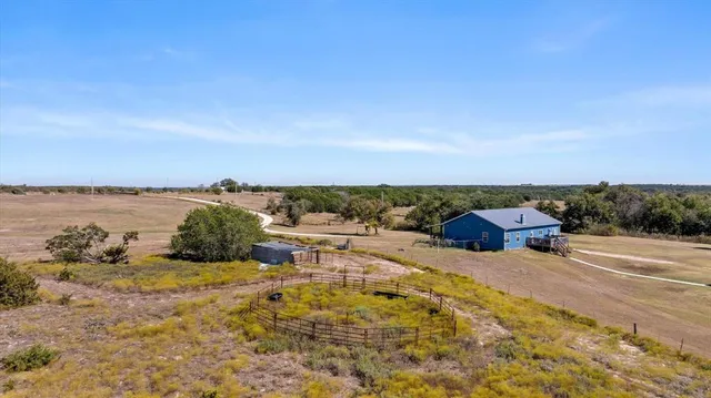 an aerial view of a house with a garden