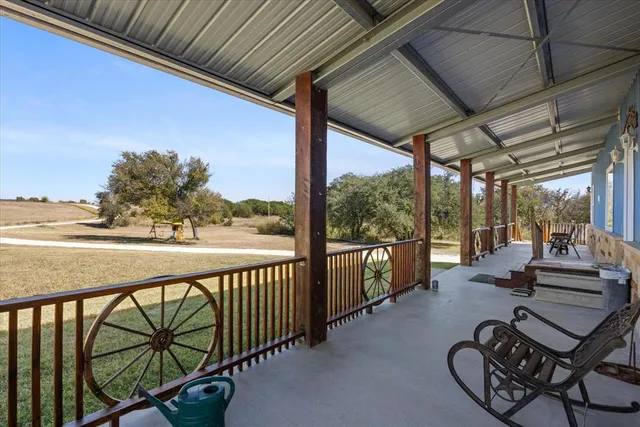 a view of a balcony with chairs