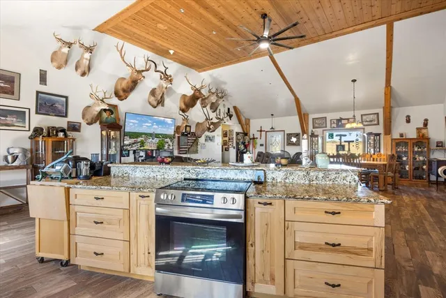 a kitchen with lots of counter top space and stainless steel appliances